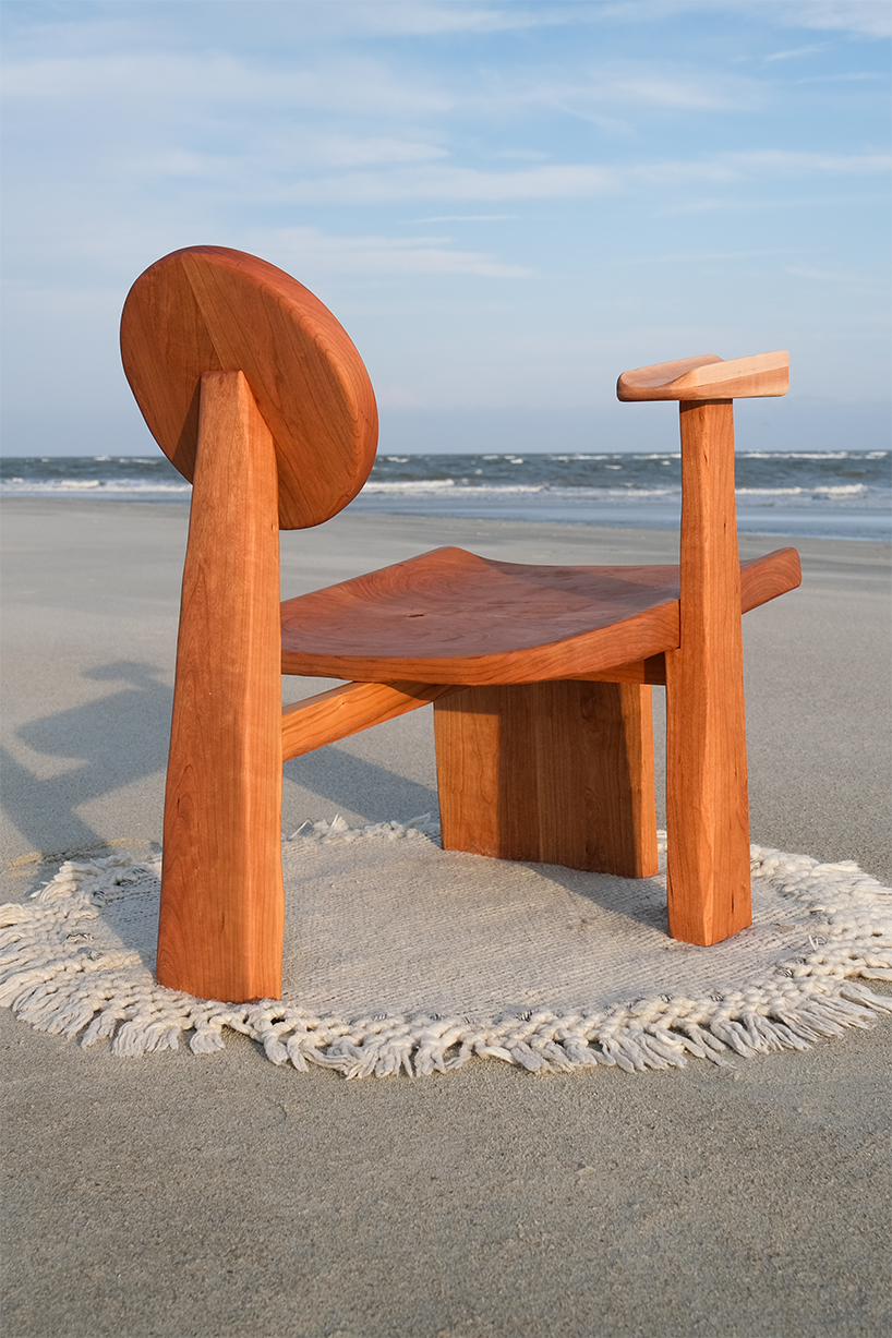 organic contours and asymmetric forms carved from cherry and maple wood define buttonback chair by nush wadia