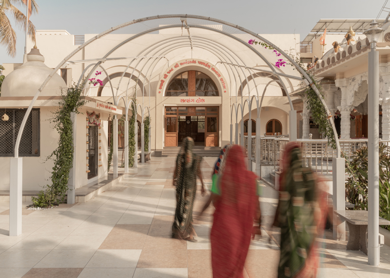 arches carve into ivory-colored walls of raasa architects' ashram in indian village
