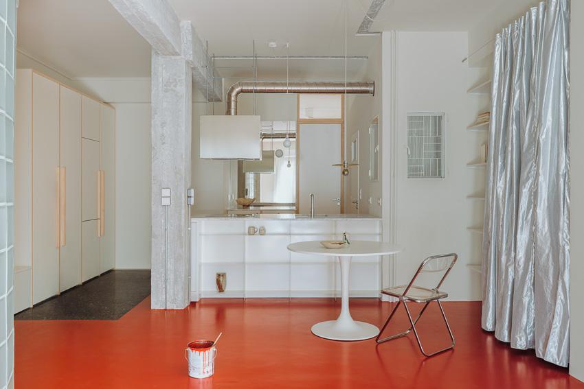 red floor runs over minimal 1970s athens apartment revamped by threshold