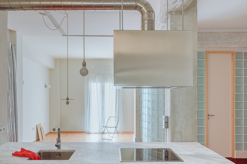 red floor runs over minimal 1970s athens apartment revamped by threshold