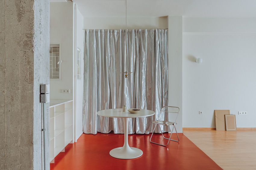 red floor runs over minimal 1970s athens apartment revamped by threshold