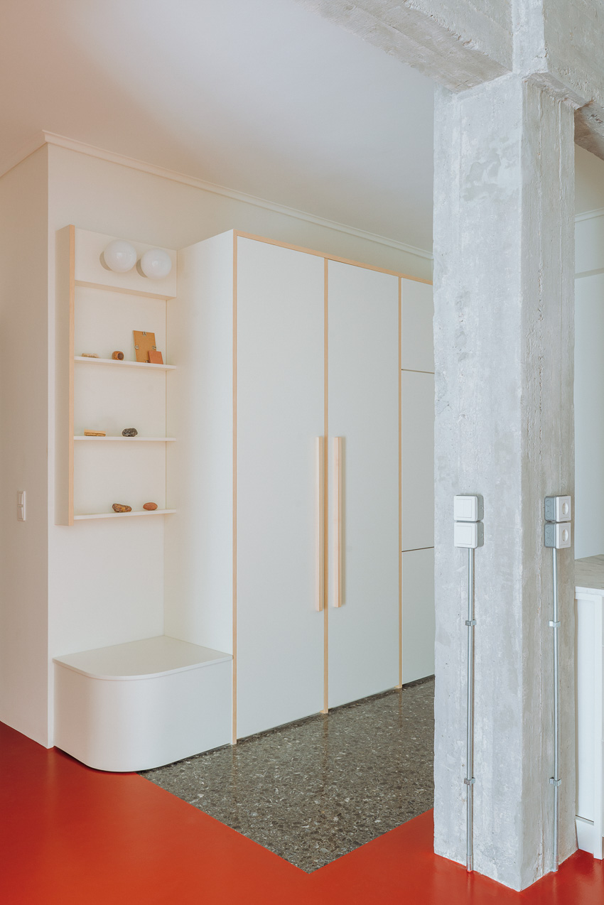 red floor runs over minimal 1970s athens apartment revamped by threshold