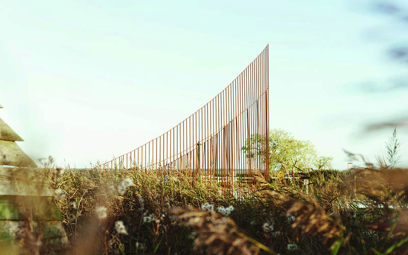 hundreds of vertical untreated steel rebars shape maetherea's kinetic installation in the UK