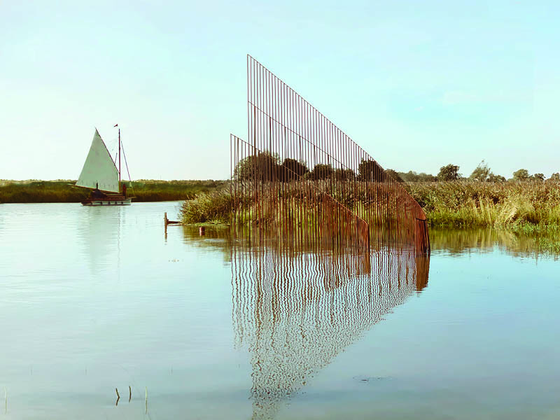 hundreds of vertical untreated steel rebars shape maetherea's kinetic installation in the UK