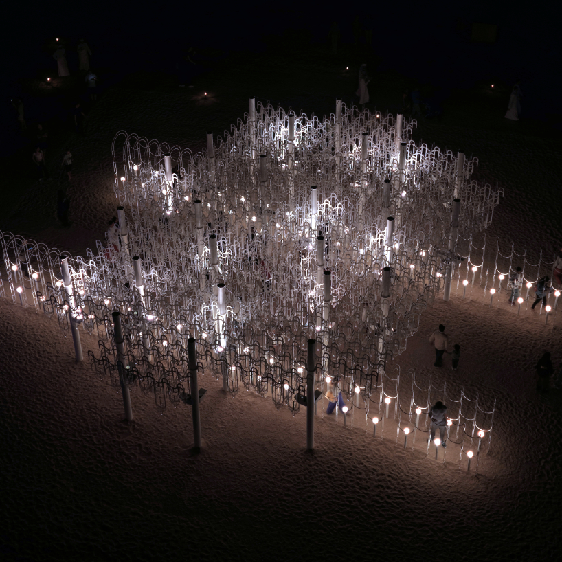 cloud-like white canopy of hanging vines emerges from abu dhabi&rsquo;s arid landscape