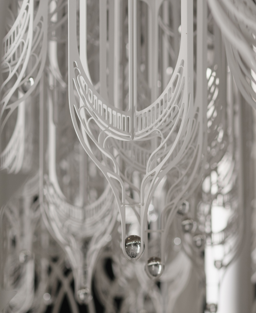 cloud-like white canopy of hanging vines emerges from abu dhabi&rsquo;s arid landscape