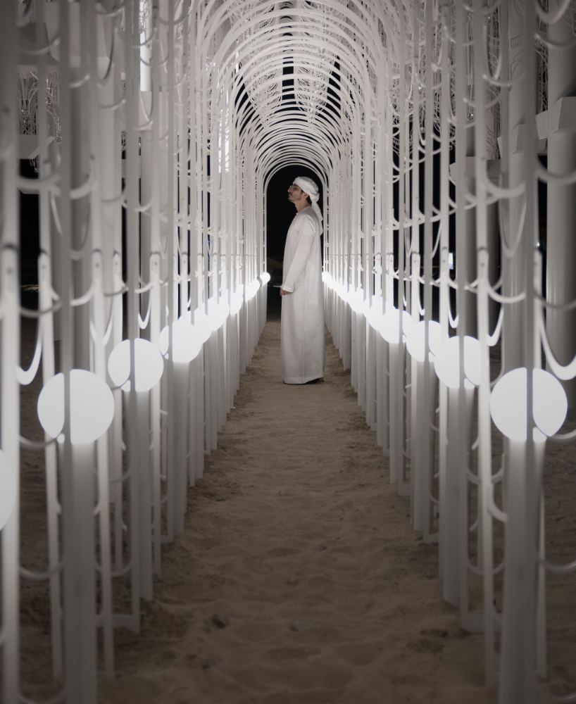 cloud-like white canopy of hanging vines emerges from abu dhabi&rsquo;s arid landscape