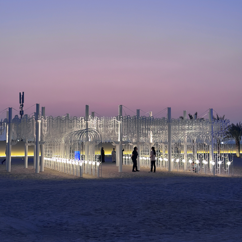 cloud-like white canopy of hanging vines emerges from abu dhabi&rsquo;s arid landscape
