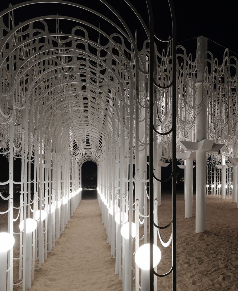 cloud-like white canopy of hanging vines emerges from abu dhabi&rsquo;s arid landscape
