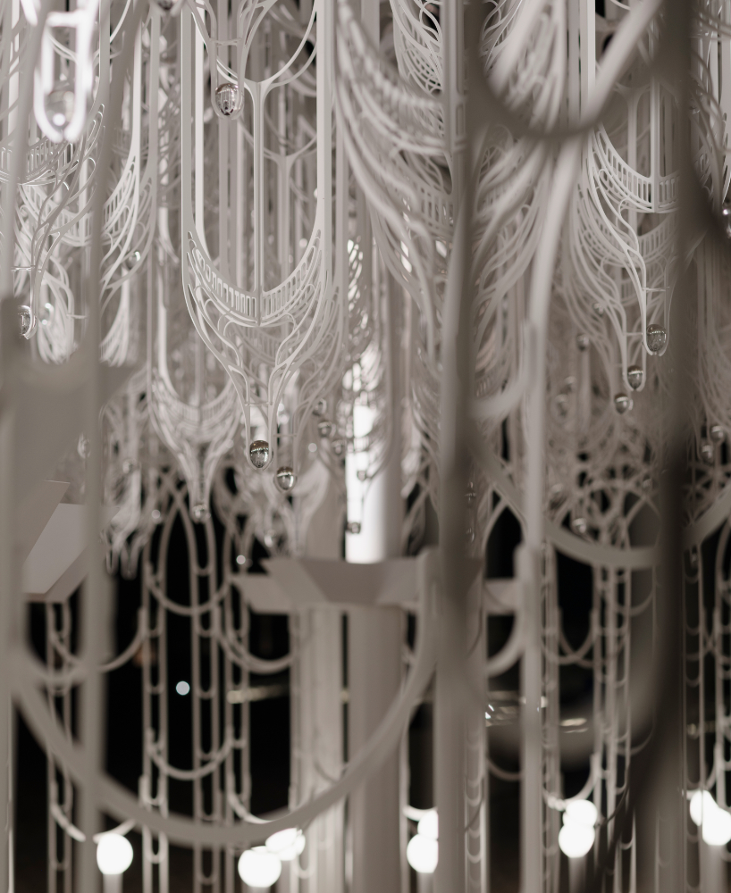 cloud-like white canopy of hanging vines emerges from abu dhabi&rsquo;s arid landscape