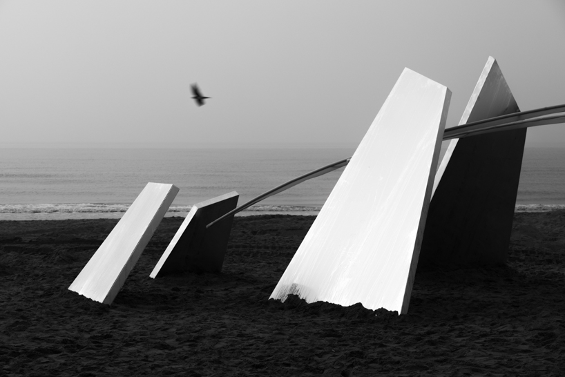 two suspended white wings float around luminous central sphere for oas/s-nest installation