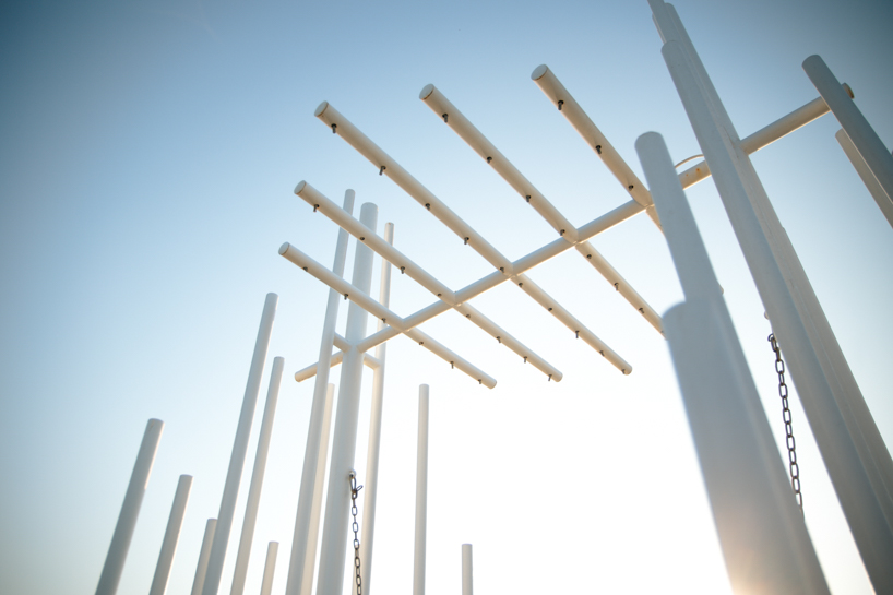 forest of steel pillars creates swinging installation enveloped in cloud-like mist in china