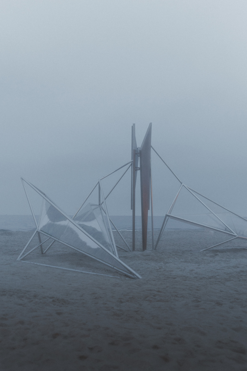 interconnected metal rods form a luminous winged installation on china's coastline - 7