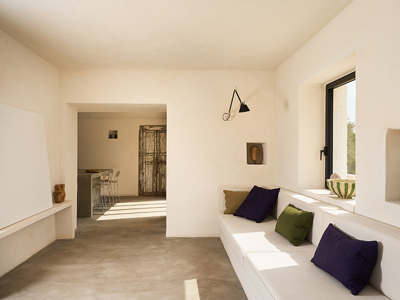 three traditional stone-domed trulli fuse with contemporary residence by studio8 in italy