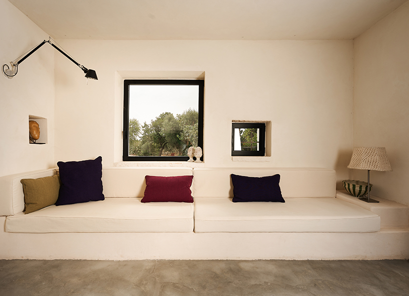 three traditional stone-domed trulli fuse with contemporary residence by studio8 in italy