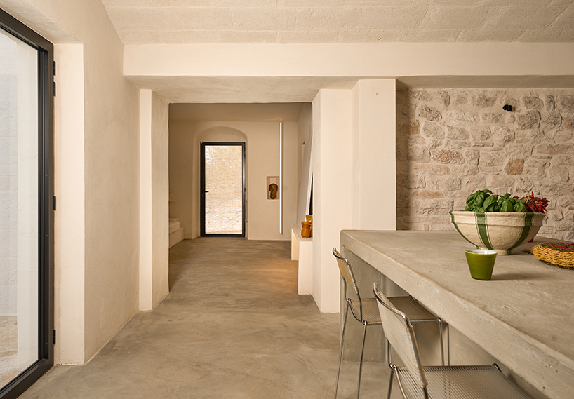 three traditional stone-domed trulli fuse with contemporary residence by studio8 in italy