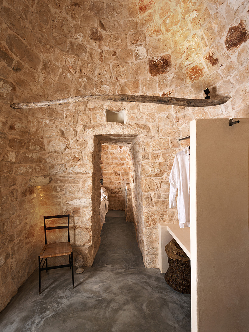 three traditional stone-domed trulli fuse with contemporary residence by studio8 in italy