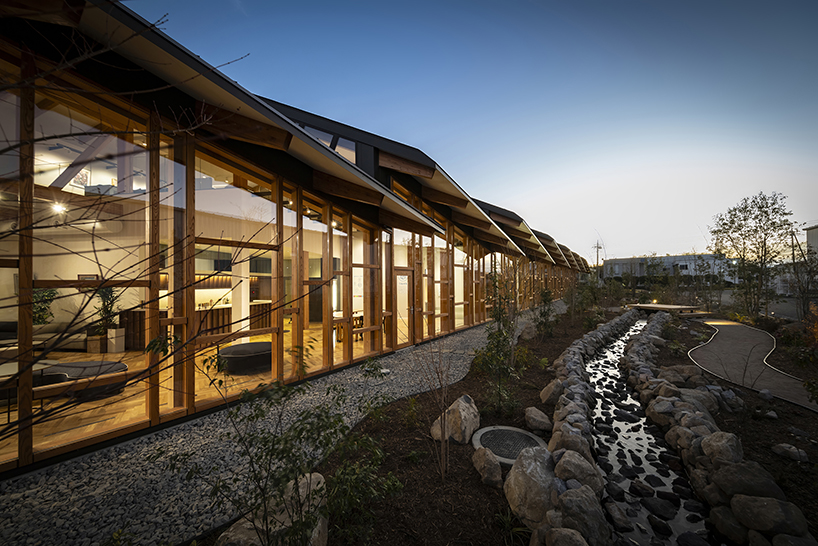 seven overlapping gabled roofs spread over haruna innovation center in japan