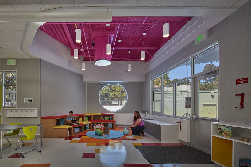 colored louvers wrap around los angeles elementary school's curved exterior by JFAK