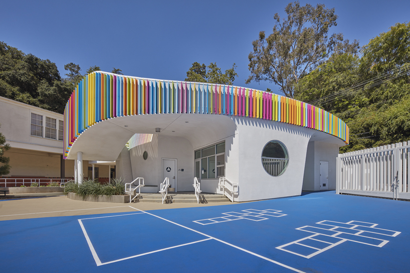 colored louvers wrap around los angeles elementary school's curved exterior by JFAK