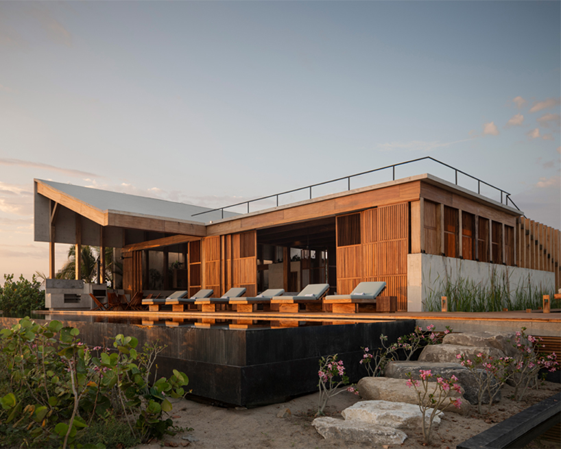 wood and concrete volumes form seaside retreat by taller alberto calleja / TAC in mexico