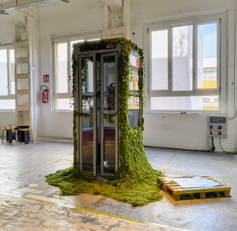 AI voice agent embeds within moss-covered phone booth at milan design week