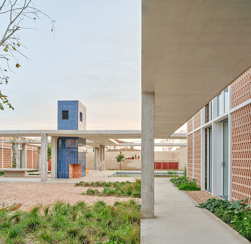 da.ch. crafts layered stone-paved landscape for casa tres patis in catalunya