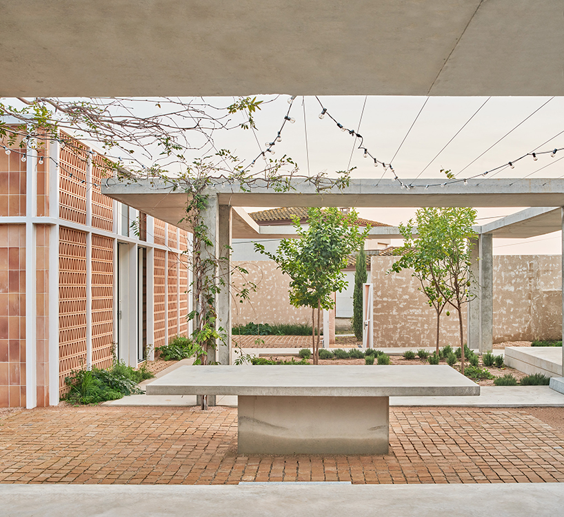 da.ch. crafts layered stone-paved landscape for casa tres patis in catalunya