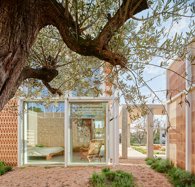 da.ch. crafts layered stone-paved landscape for casa tres patis in catalunya