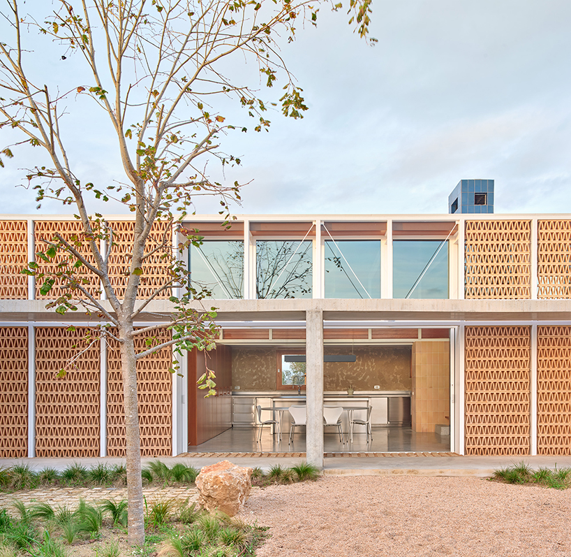 da.ch. crafts layered stone-paved landscape for casa tres patis in catalunya