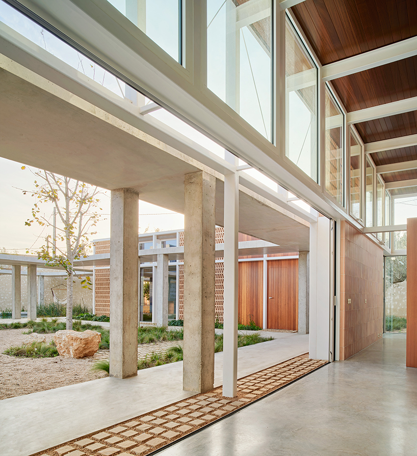 da.ch. crafts layered stone-paved landscape for casa tres patis in catalunya