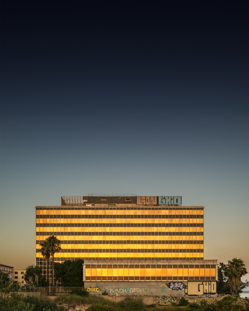photo series by lluís bort captures mallorca's abandoned buildings under gradient blue skies
