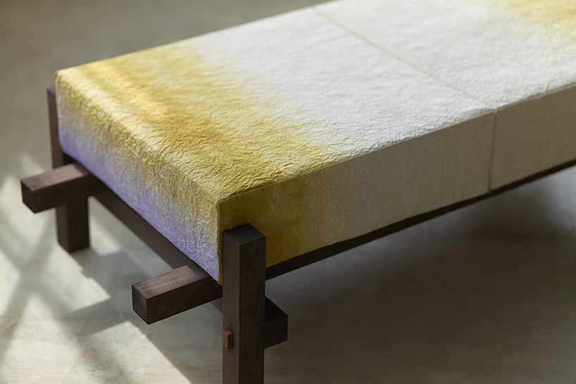 swarm dyes washi paper with hues of purple and gold for installation at milan design week
