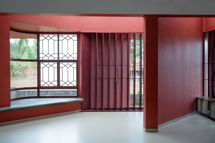 geometric red wall segments emerge from saba house's white body in indian highlands