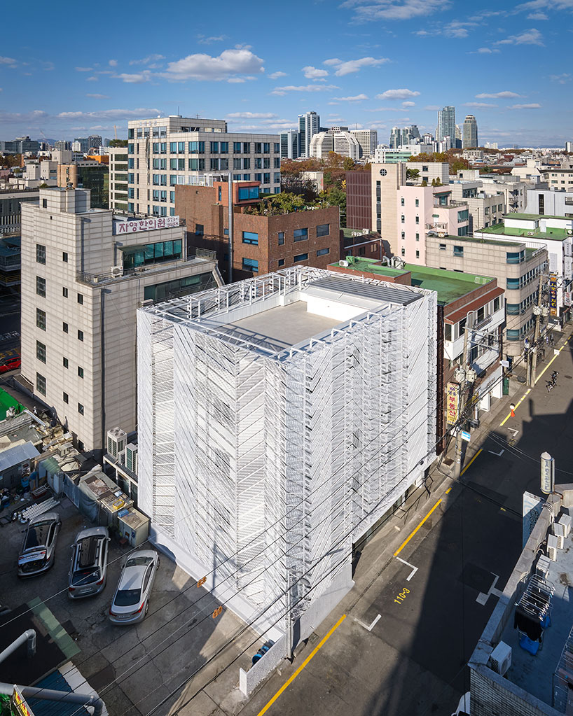 perforated metal panels reframe buildings exterior into responsive facade in seoul perforated metal panels reframe buildings... 