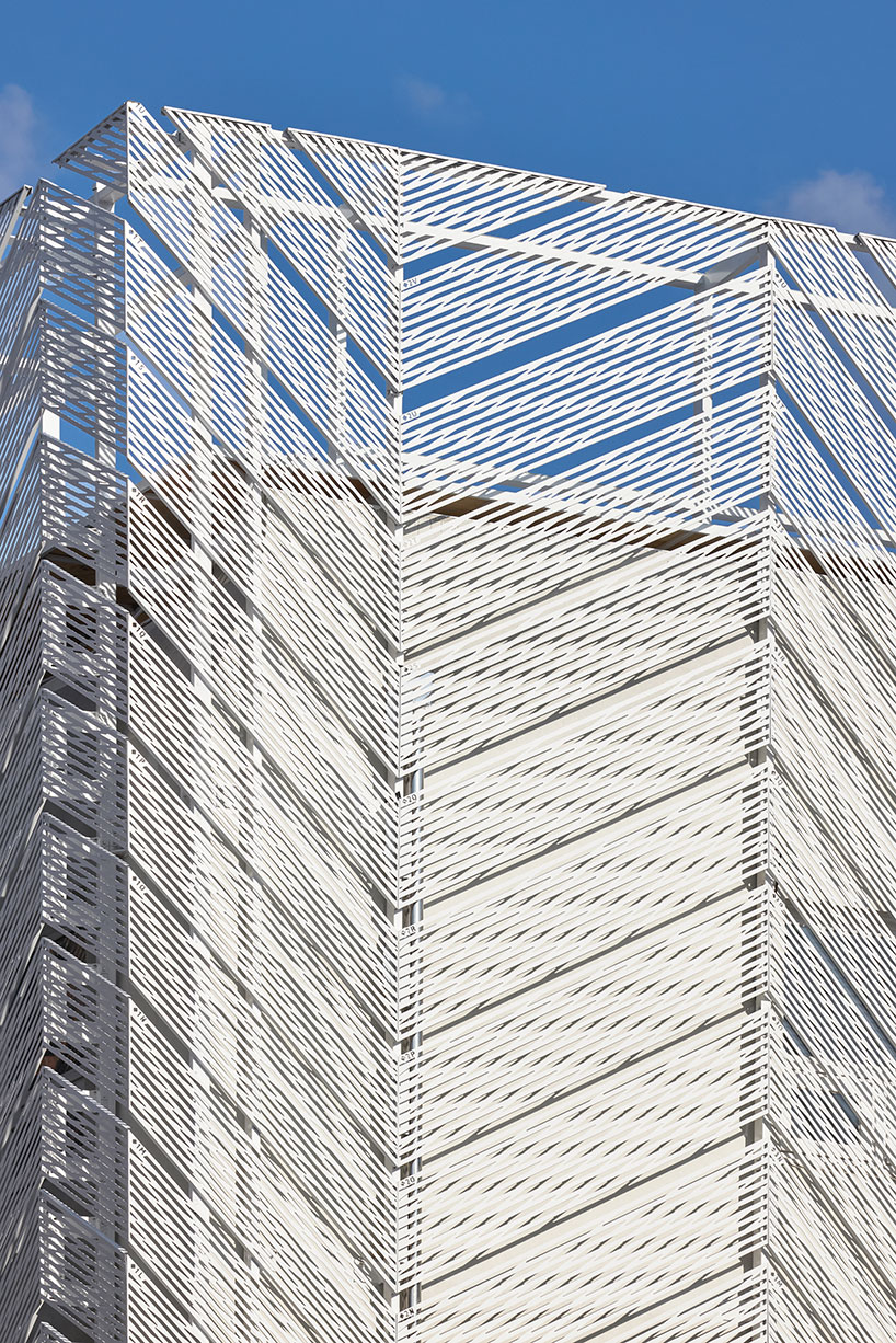 perforated metal panels reframe building's exterior into responsive facade system in seoul