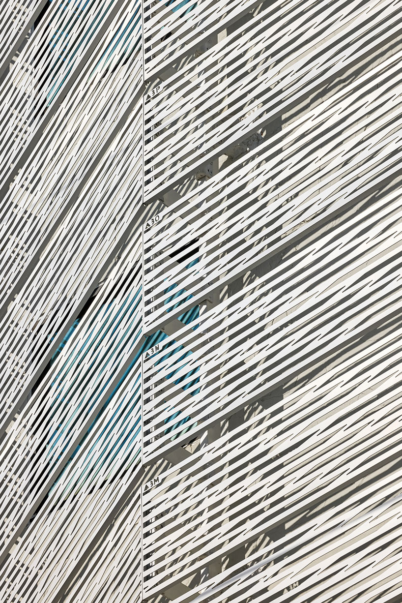 perforated metal panels reframe building's exterior into responsive facade system in seoul