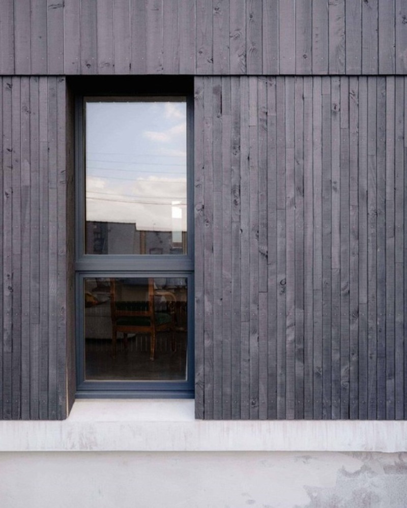 Dark slabs of coat wood from Saint-Malo by Maab Architects, seated on Pltth of Stone