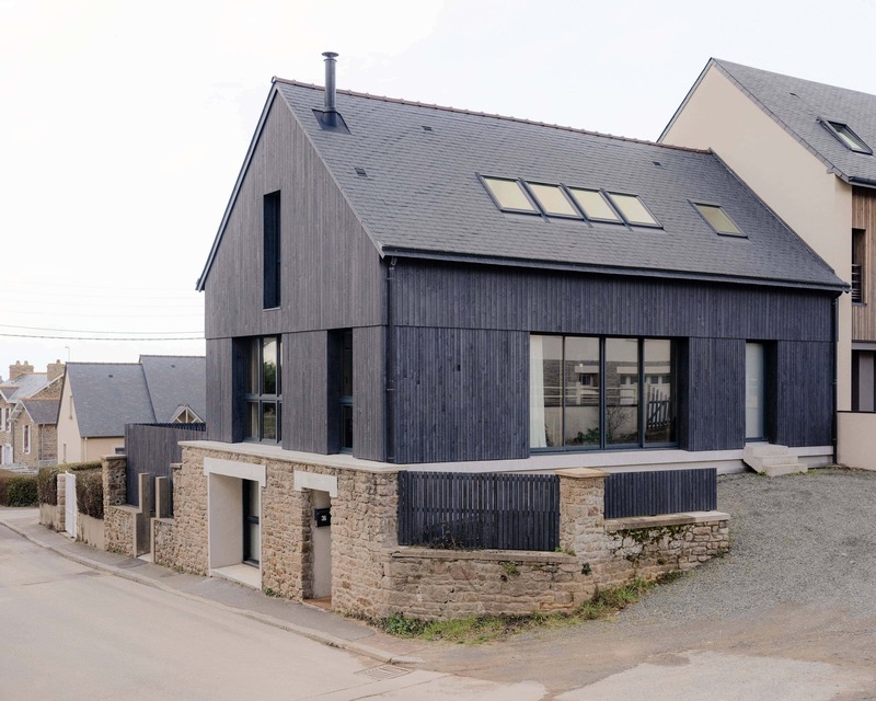 Dark slabs of coat wood from Saint-Malo by Maab Architects, seated on Pltth of Stone