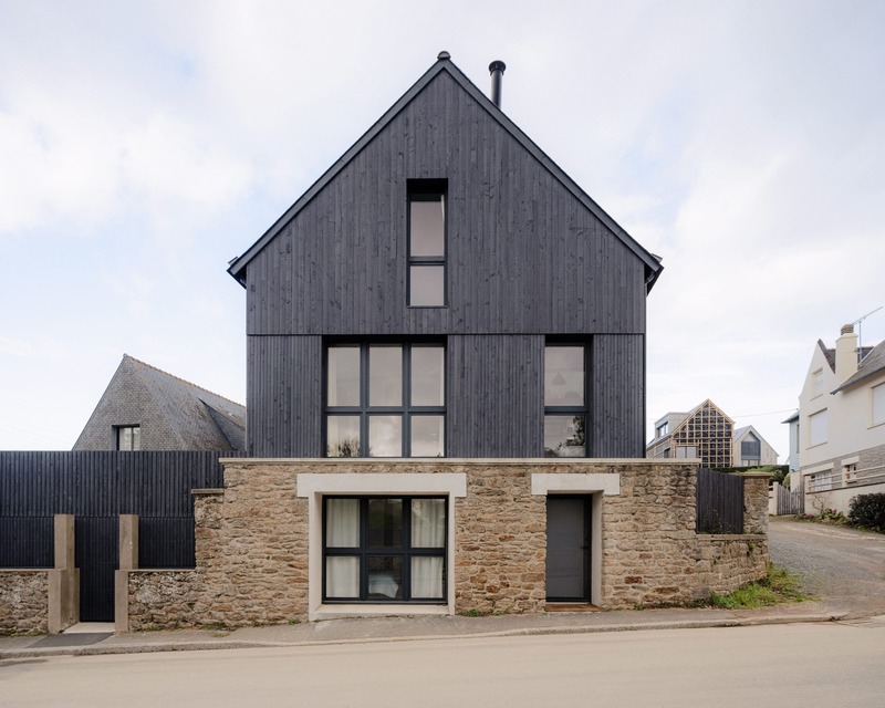 Dark slabs of coat wood from Saint-Malo by Maab Architects, seated on Pltth of Stone