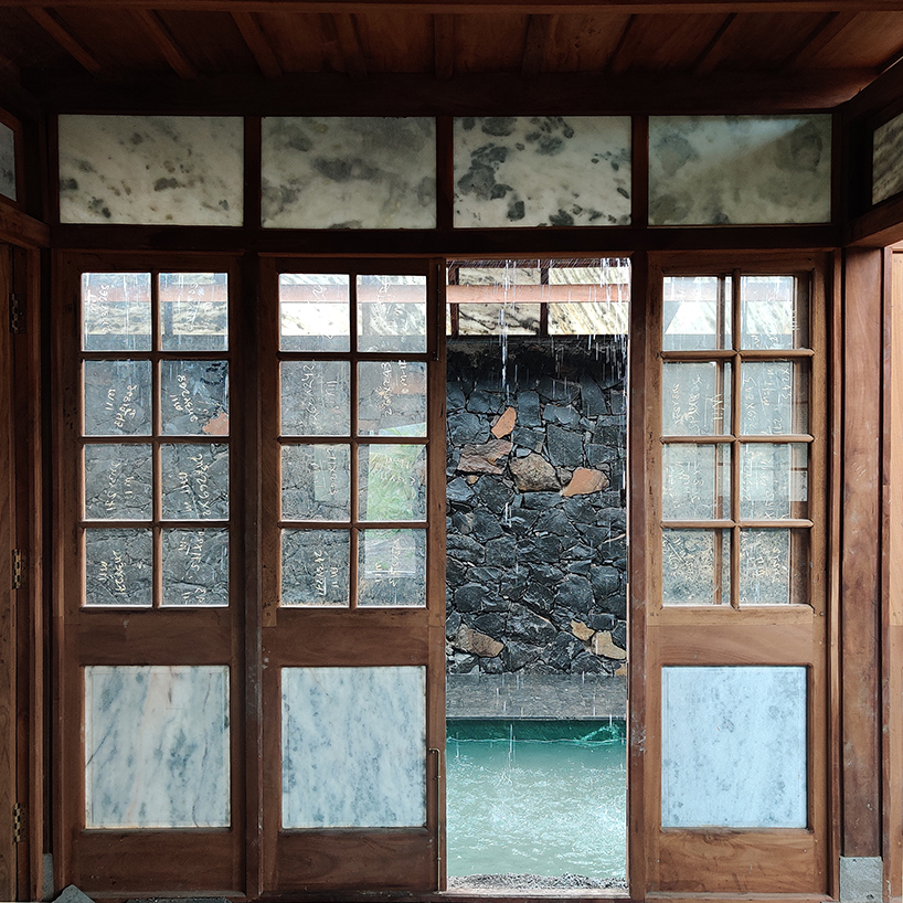 metis practice combines wooden shingles and copper for pali farmhouse's roofing in india