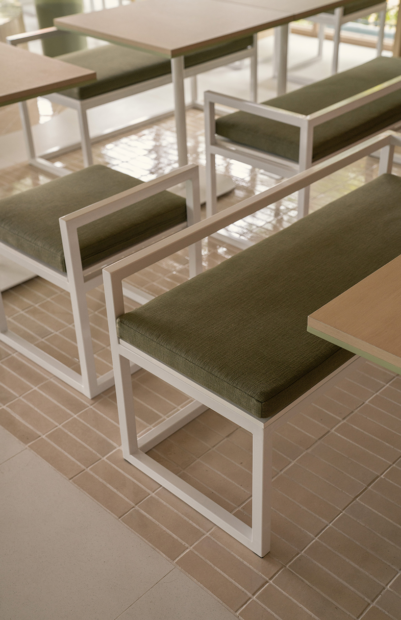 handmade terracotta tiles meet oak surfaces within tri-oz café’s tranquil interiors in thailand - 7