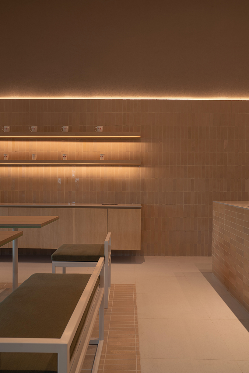 handmade terracotta tiles meet oak surfaces within tri-oz café’s tranquil interiors in thailand - 9