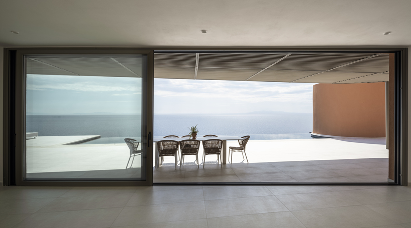 olen resort embeds into greek island slope across three terraced levels - 11