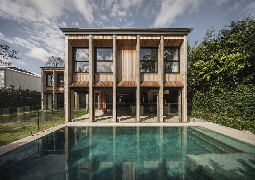 bold concrete frame by george kouparitsas reshapes pre-war cottage's facade in australia