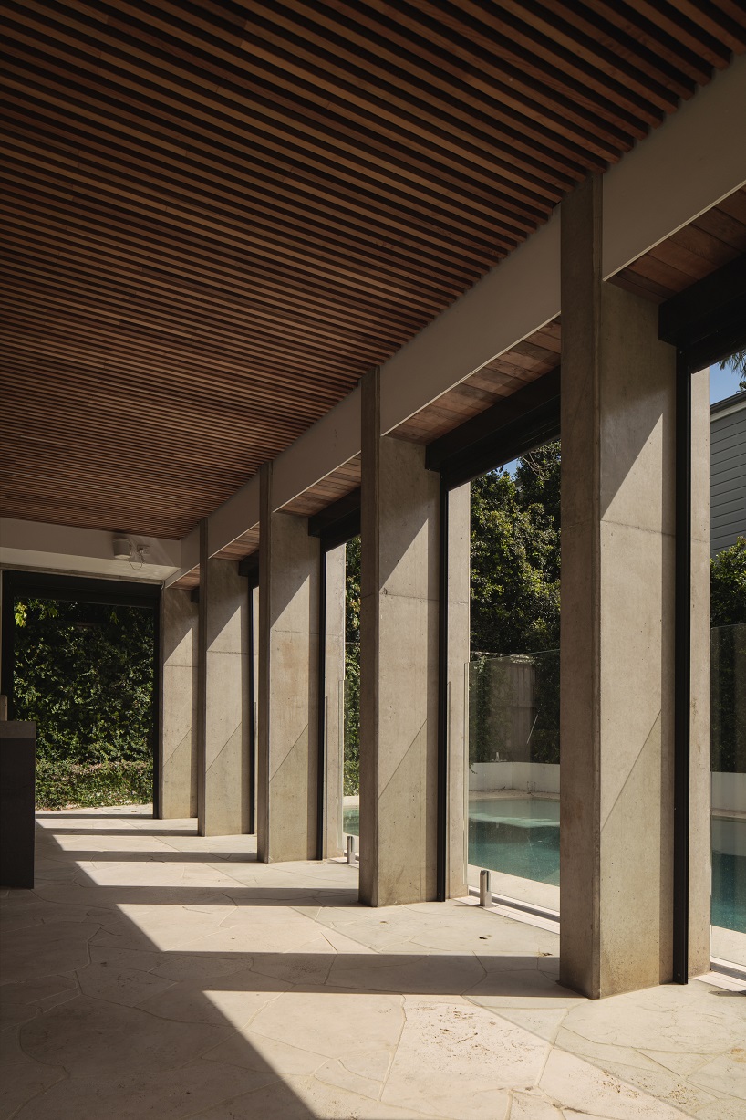 bold concrete frame by george kouparitsas reshapes pre-war cottage's facade in australia