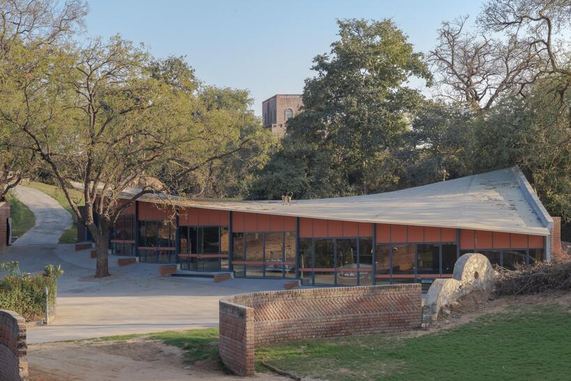 curved canopy shelters stepped house-gallery hybrid by milind shivani in india