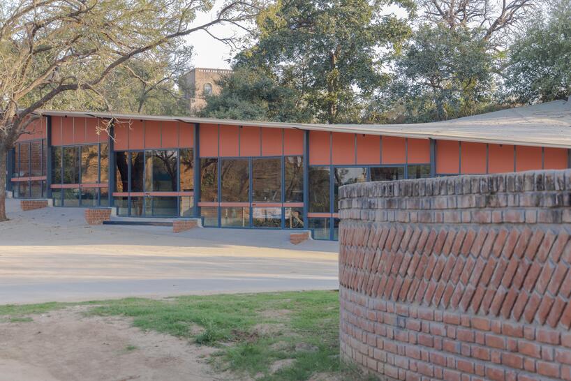 curved canopy shelters stepped house-gallery hybrid by milind shivani in india