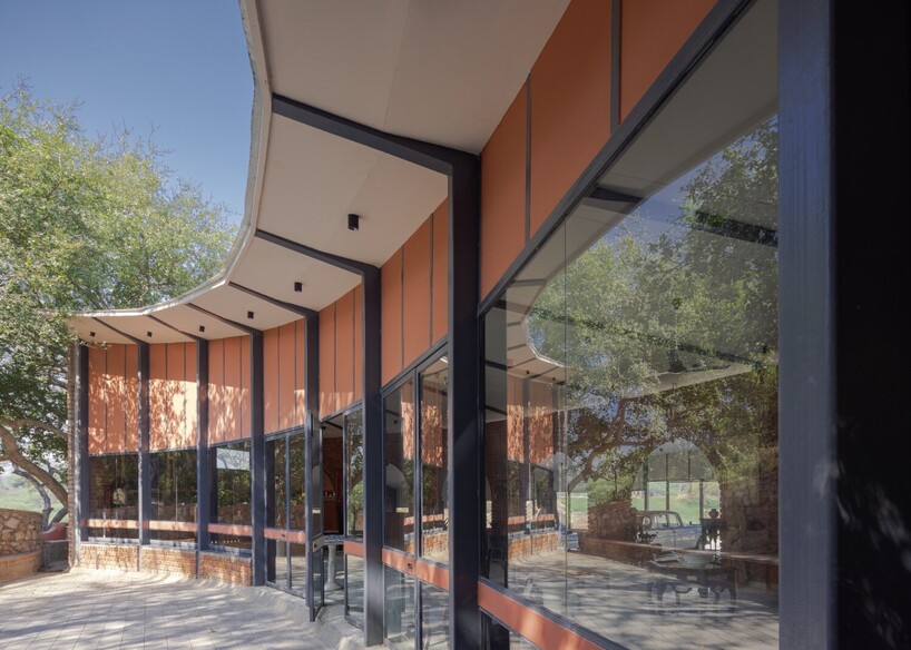 curved canopy shelters stepped house-gallery hybrid by milind shivani in india