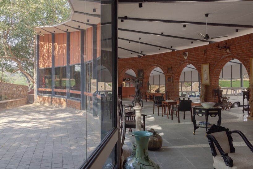 curved canopy shelters stepped house-gallery hybrid by milind shivani in india